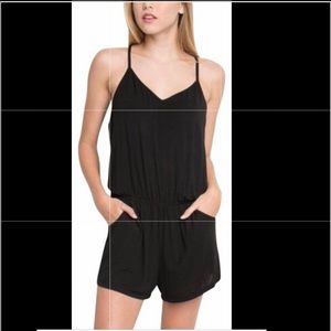 Brandy Melville black V Neck romper with Size pockets Size small.